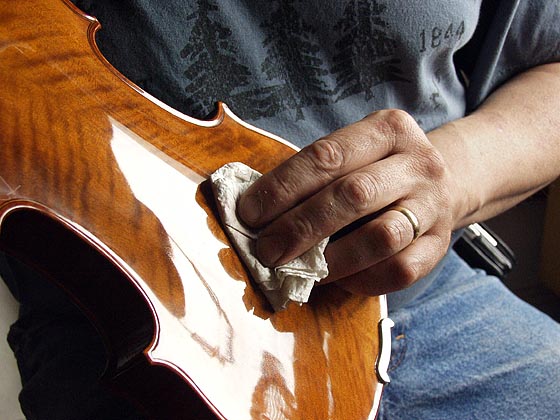 polishing a violin